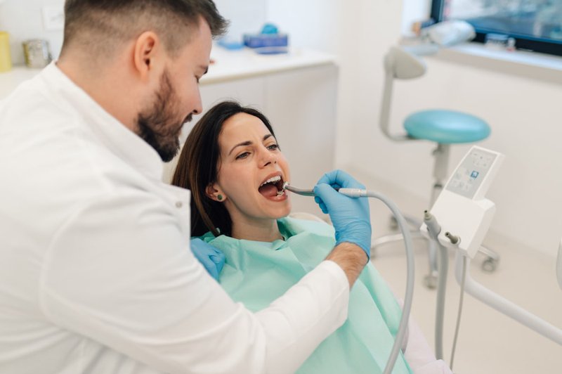 Close-up of cavity treatment with dental drill during a procedure