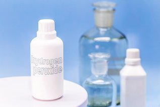 Plastic container of hydrogen peroxide used for oral rinsing